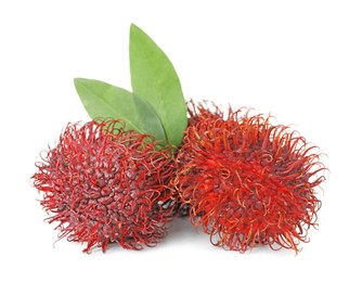 Delicious ripe rambutans and green leaves isolated on white. Exotic fruit