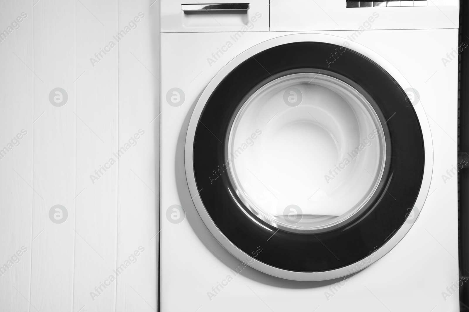 Photo of Washing machine with suds as background, closeup. Space for text