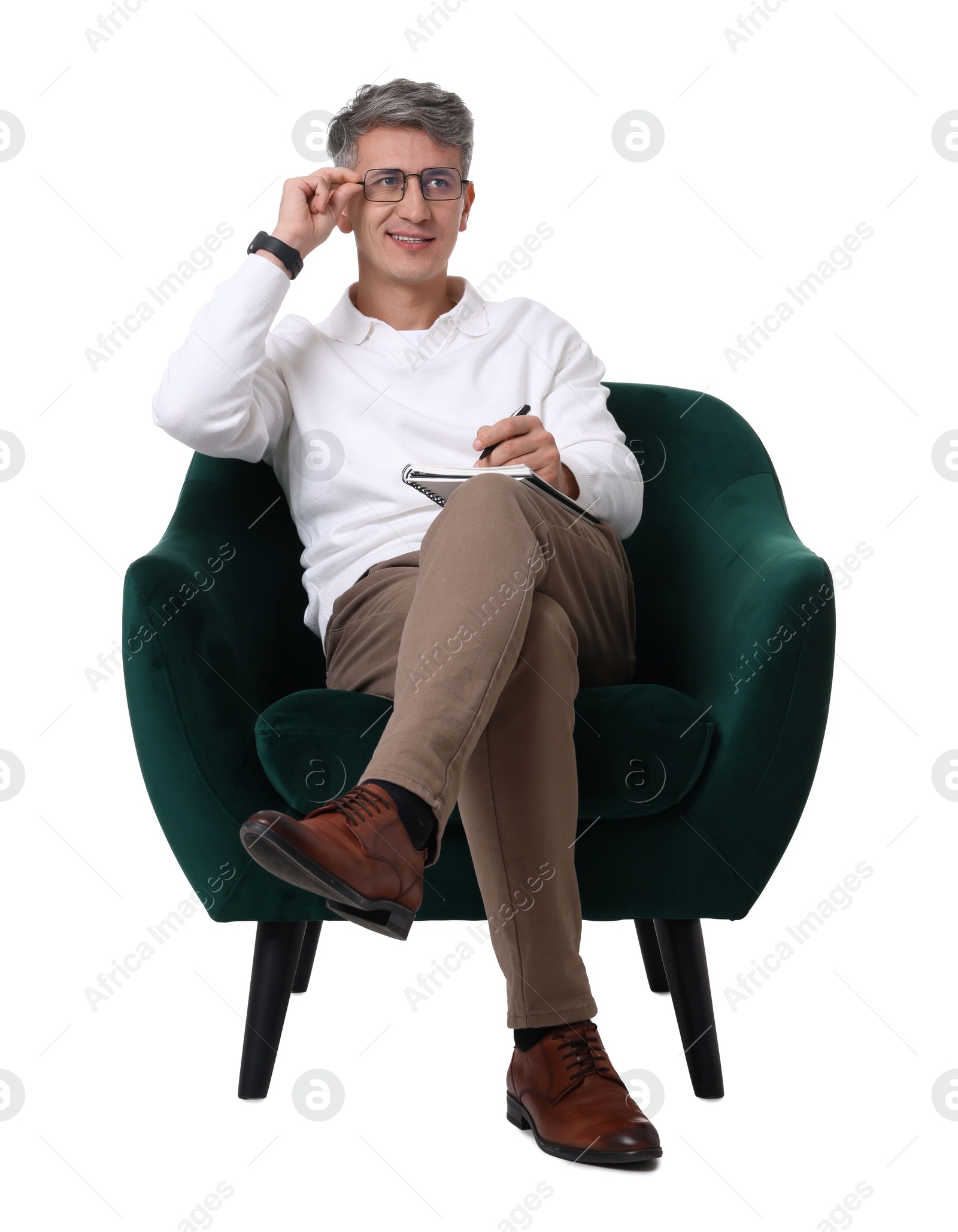 Photo of Professional psychologist with notebook sitting on chair against white background