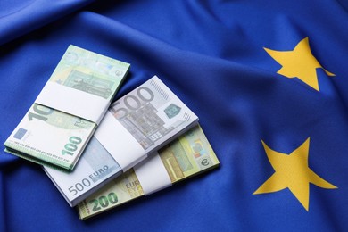 Photo of Euro banknotes on European Union flag, above view