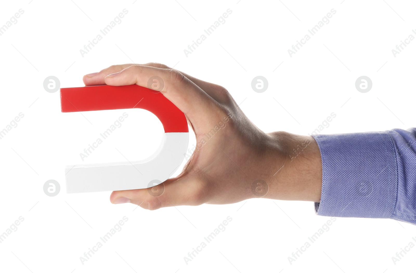 Photo of Man with horseshoe magnet on white background, closeup