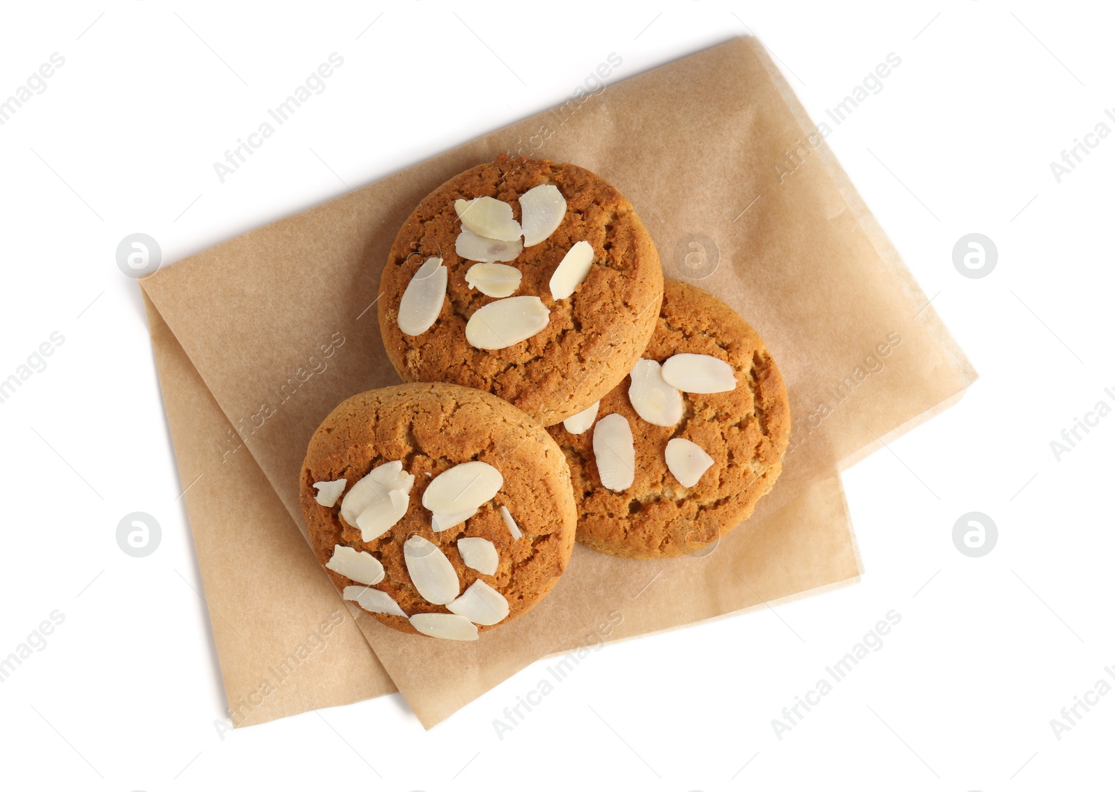 Photo of Tasty cookies with almond flakes isolated on white, top view