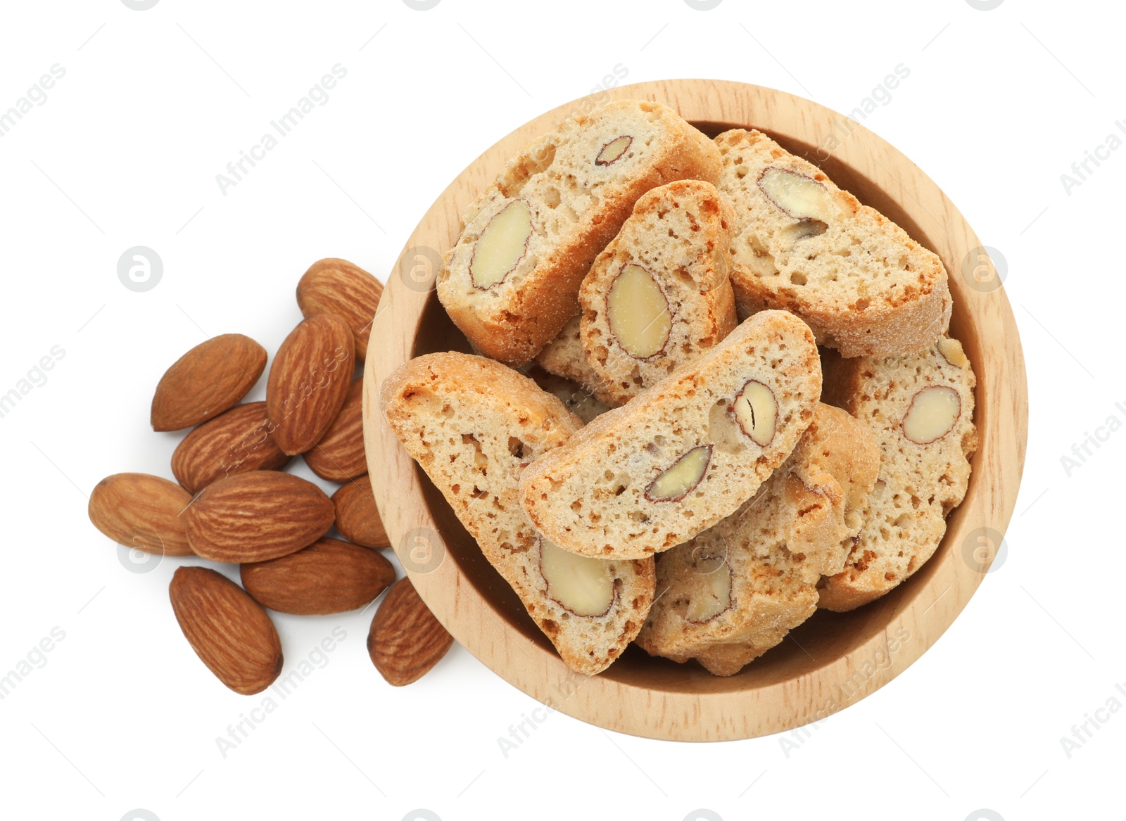 Photo of Traditional Italian almond biscuits (Cantucci) in bowl and nuts isolated on white, top view