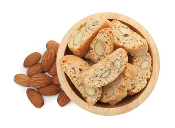 Photo of Traditional Italian almond biscuits (Cantucci) in bowl and nuts isolated on white, top view