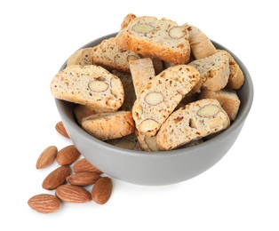 Photo of Traditional Italian almond biscuits (Cantucci) in bowl and nuts isolated on white