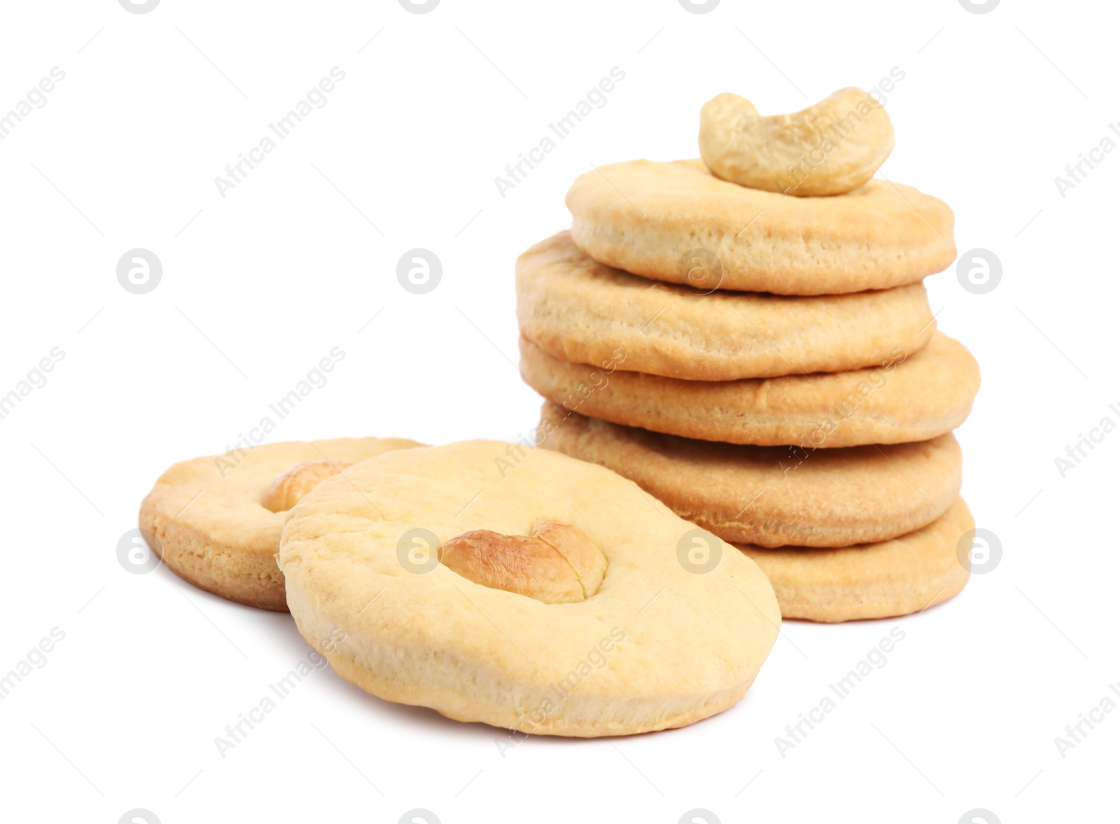 Photo of Many tasty cashew cookies isolated on white