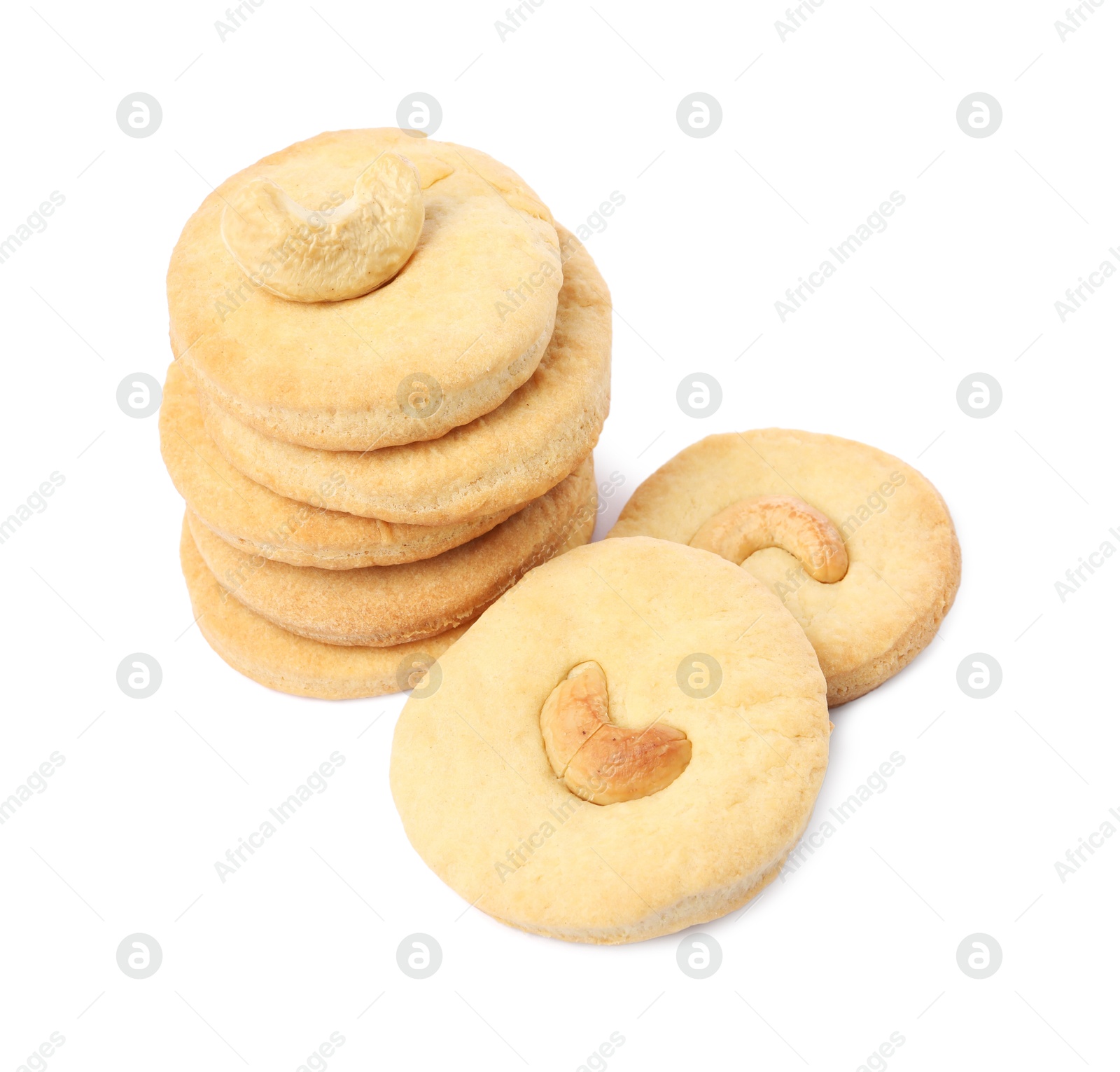 Photo of Many tasty cashew cookies isolated on white