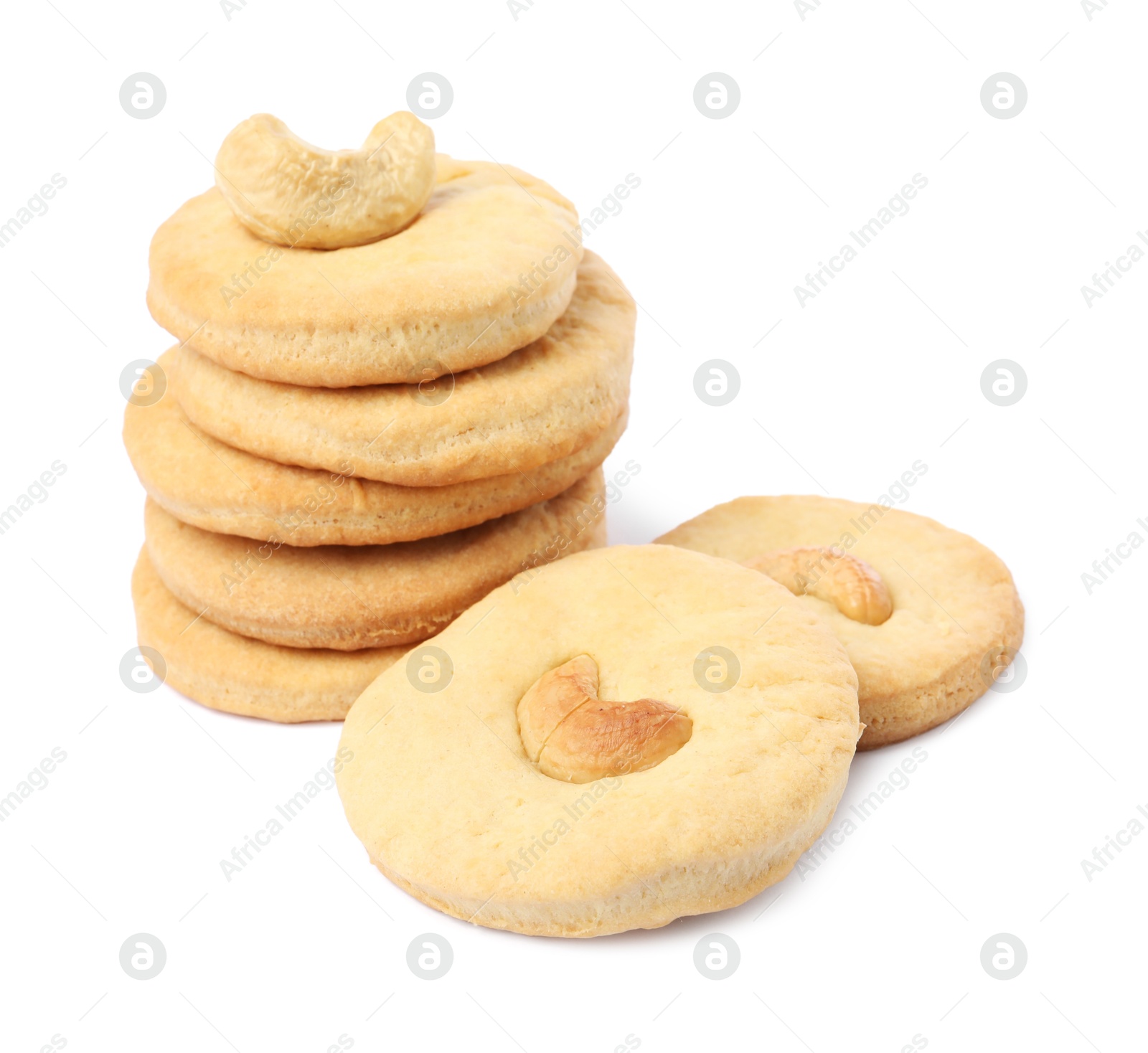 Photo of Many tasty cashew cookies isolated on white