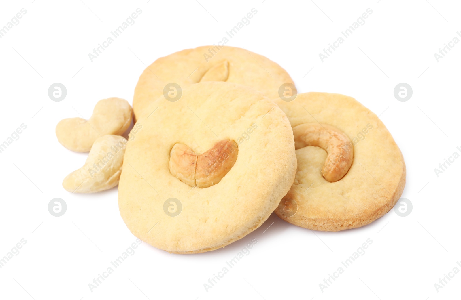 Photo of Many tasty cashew cookies isolated on white