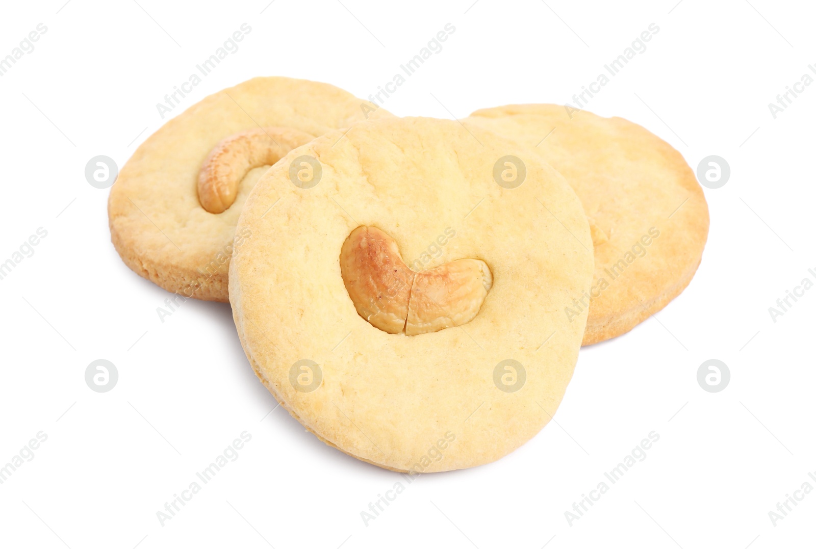 Photo of Three tasty cashew cookies isolated on white