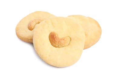 Photo of Three tasty cashew cookies isolated on white