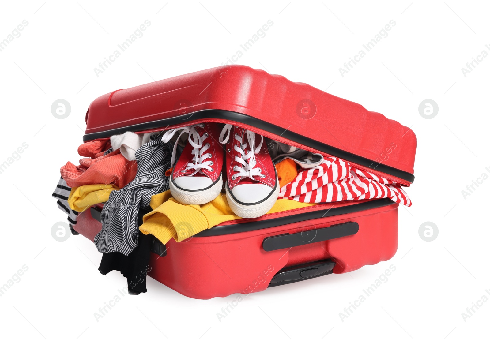 Photo of Packed suitcase full of clothes isolated on white