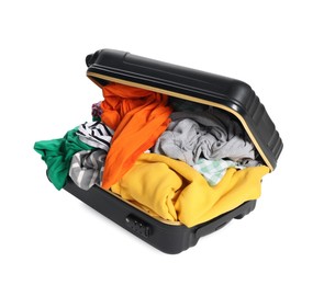 Photo of Packed suitcase full of clothes isolated on white