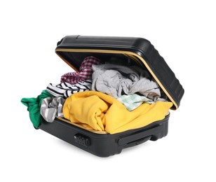 Photo of Packed suitcase full of clothes isolated on white