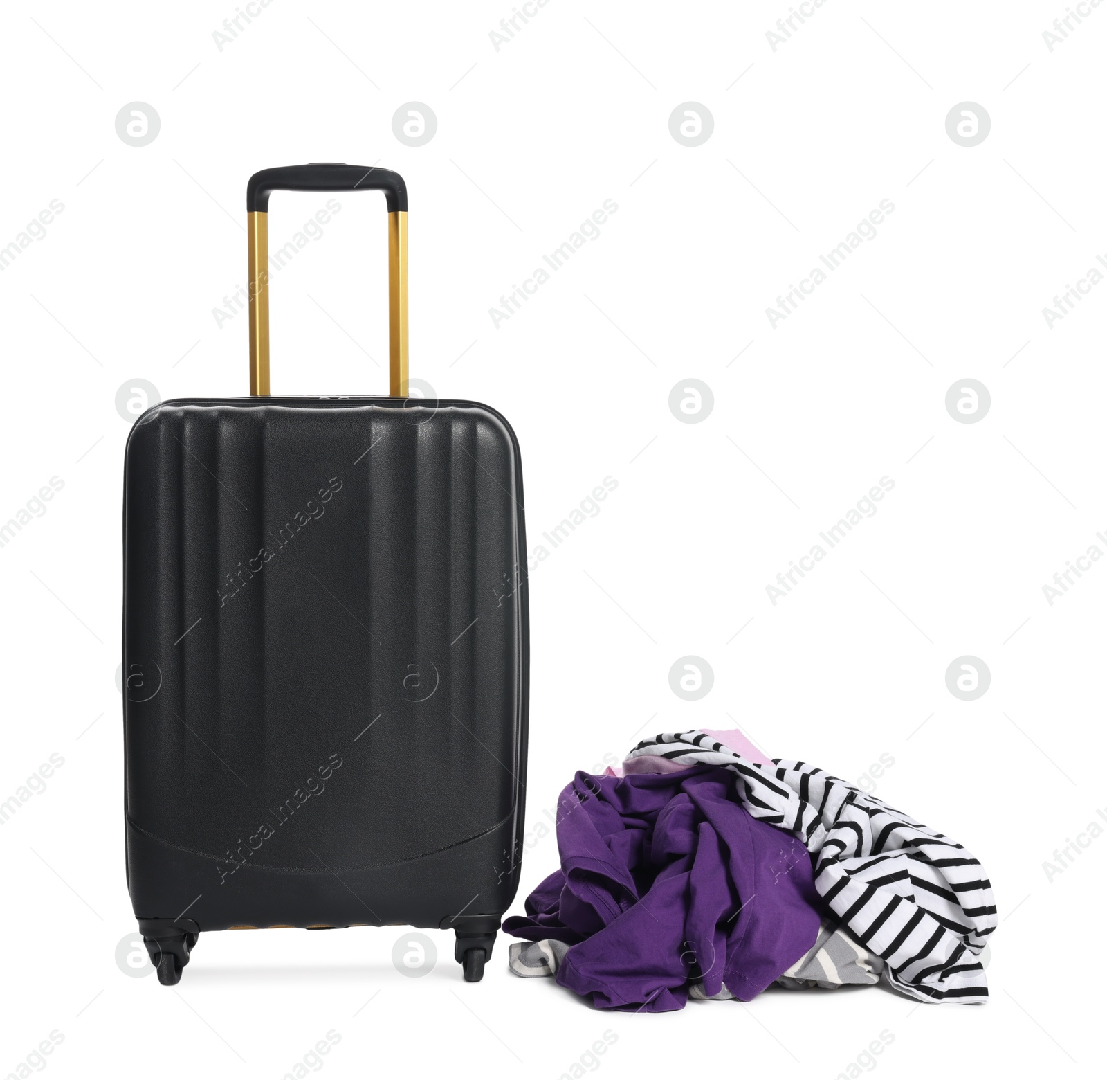 Black suitcase and messy pile of clothes isolated on white Photo of Black suitcase and messy pile of clothes isolated on white