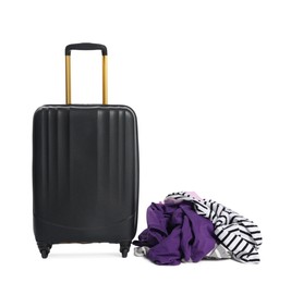 Photo of Black suitcase and messy pile of clothes isolated on white