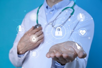 Image of Medical privacy. Health worker using virtual screen with scheme and different icons on blue background, closeup. Lock symbol over hand