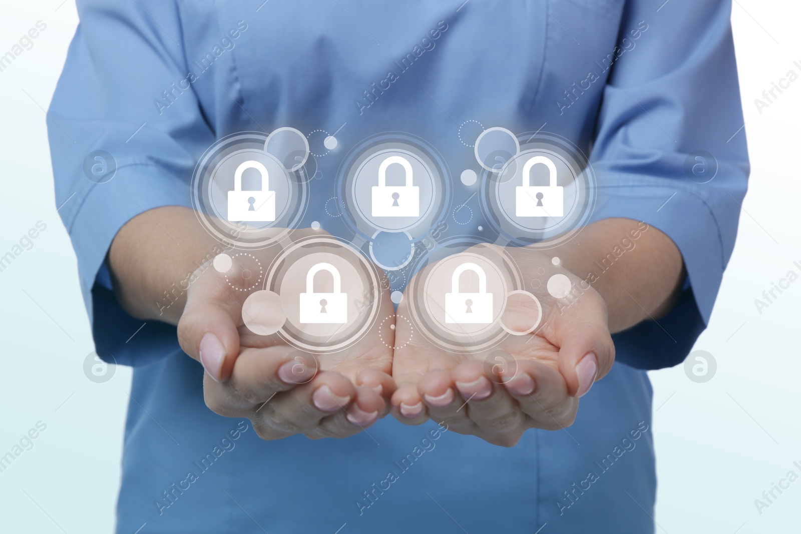 Image of Medical privacy. Health worker holding virtual with lock icons on white background, closeup