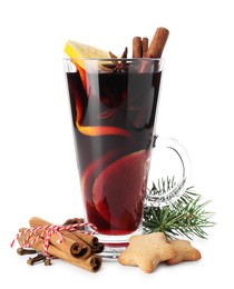 Photo of Tasty mulled wine with spices, cookies and fir branch isolated on white. Christmas drink