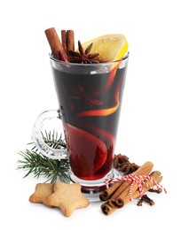 Photo of Tasty mulled wine with spices, cookies and fir branch isolated on white. Christmas drink