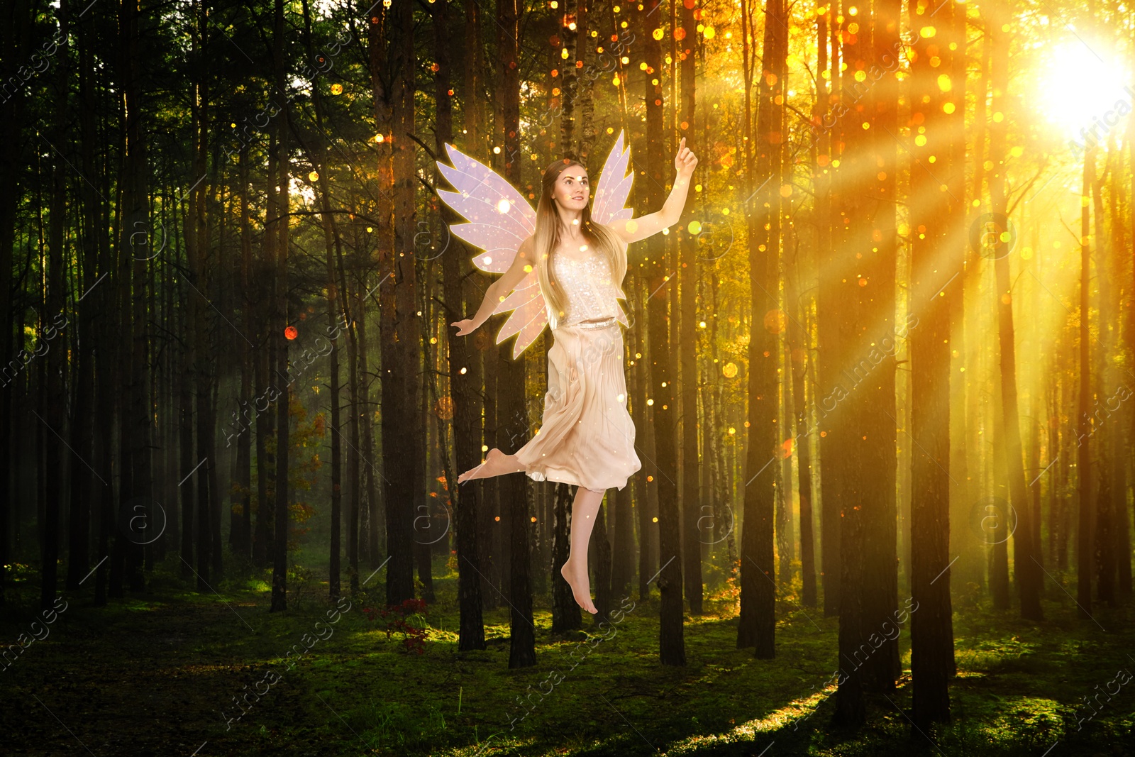 Image of Enchanting fairy flying towards magic light among trees. Mesmerizing girl with ethereal wings in charmed forest