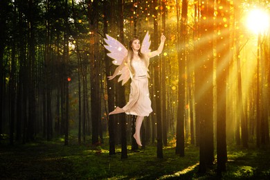 Image of Enchanting fairy flying towards magic light among trees. Mesmerizing girl with ethereal wings in charmed forest