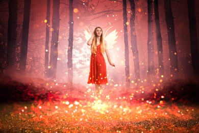 Image of Enchanting fairy surrounded by magic lights among trees. Mesmerizing girl with ethereal wings in charmed forest