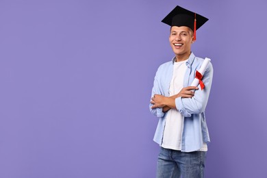 Photo of Happy student with diploma after graduation on violet background. Space for text