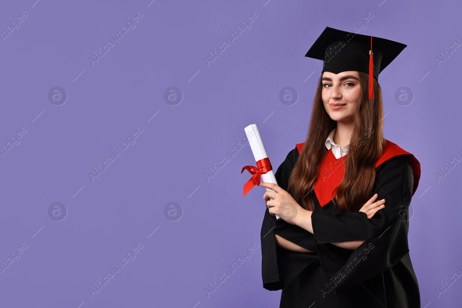 Photo of Happy student with diploma after graduation on violet background. Space for text