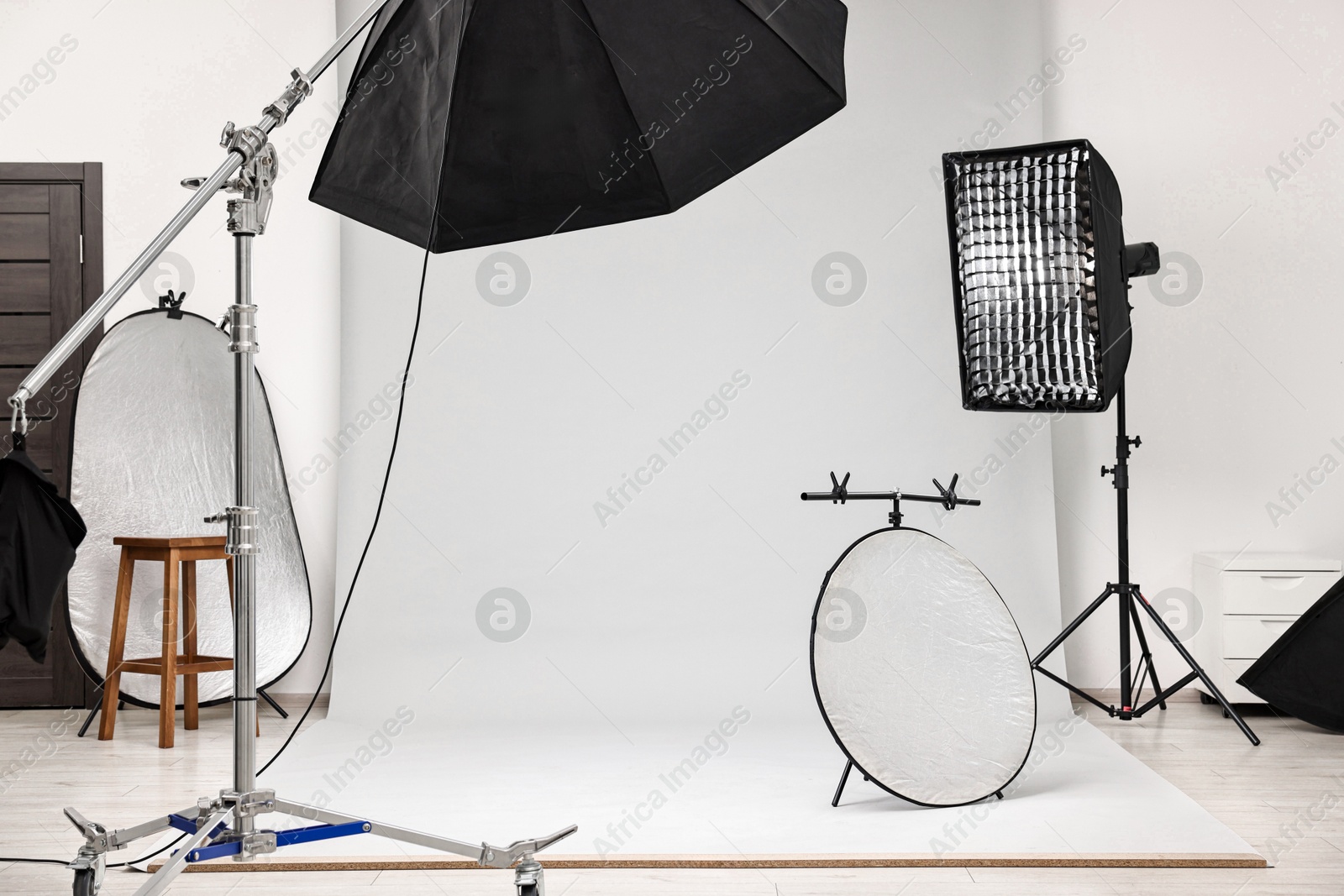 Photo of Professional lighting equipment setup in modern photo studio