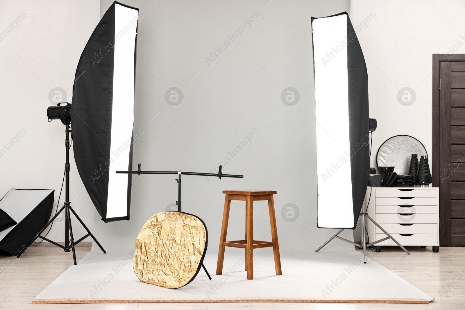 Photo of Professional lighting equipment setup in modern photo studio