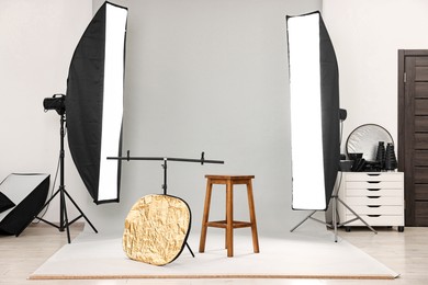 Professional lighting equipment setup in modern photo studio