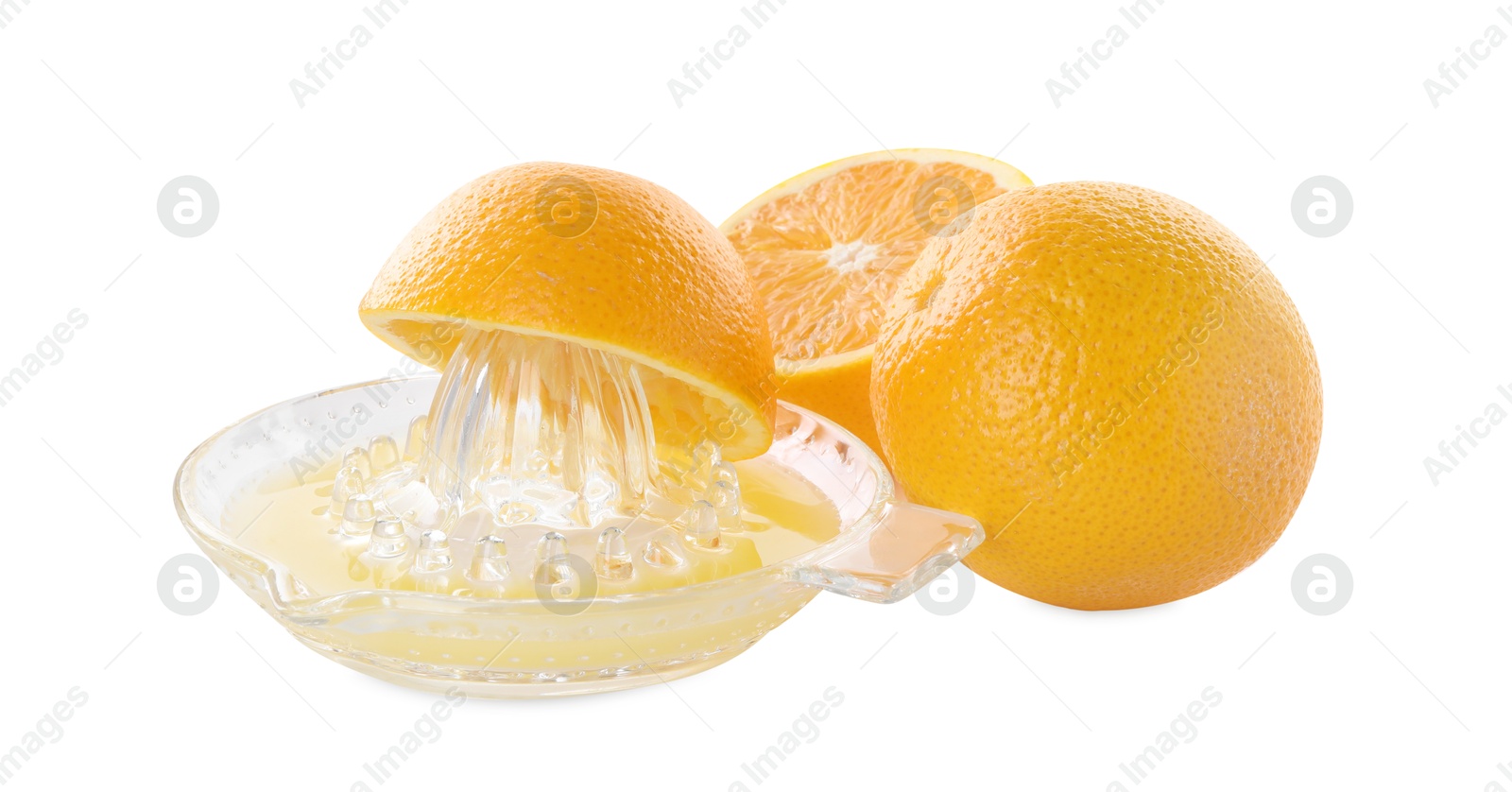 Photo of Glass juicer and oranges isolated on white