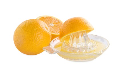 Photo of Glass juicer and oranges isolated on white