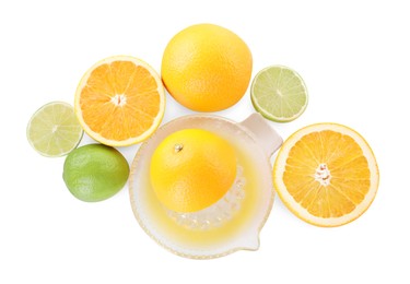 Glass juicer and different citrus fruits isolated on white, top view