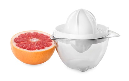 Photo of Plastic juicer and half of grapefruit isolated on white