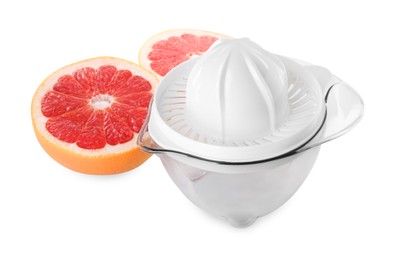 Photo of Plastic juicer and halves of grapefruit isolated on white