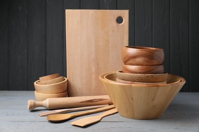 Dishware and cooking utensils on grey wooden table