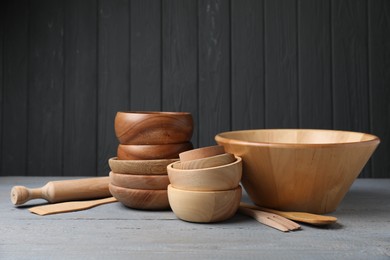 Dishware and cooking utensils on grey wooden table