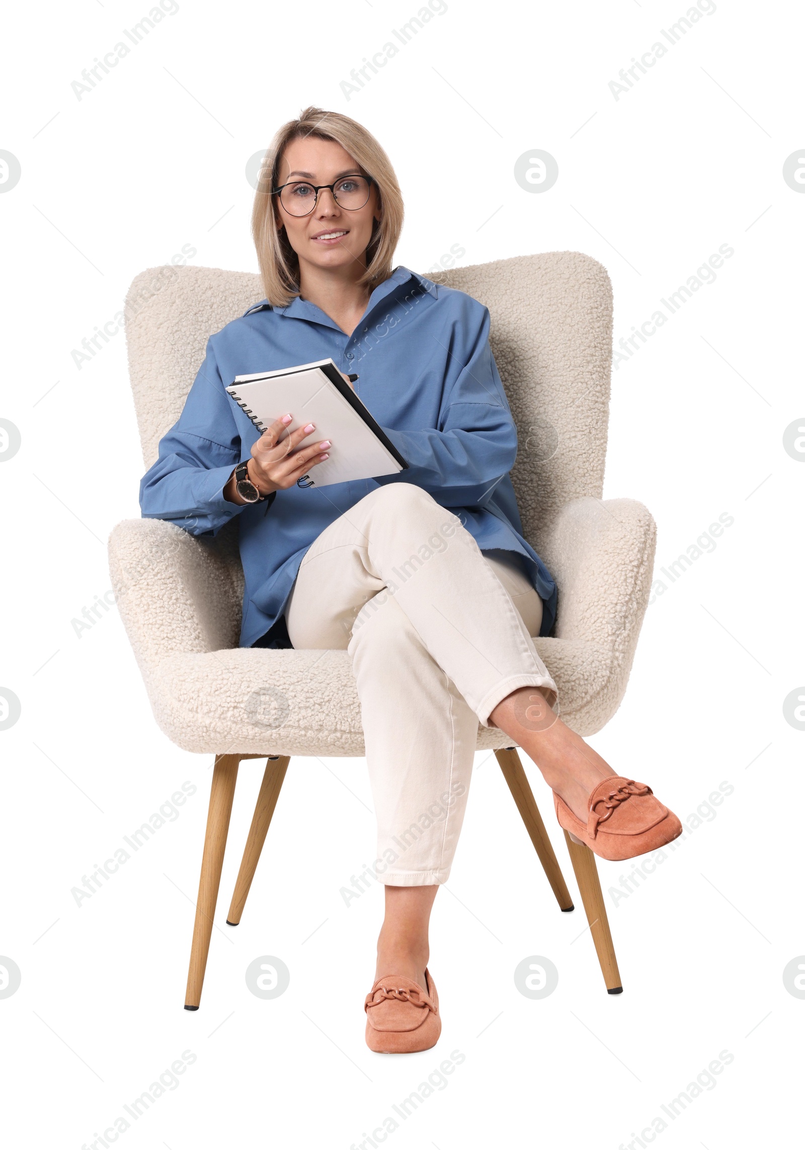 Photo of Professional psychologist with notebook sitting on chair against white background