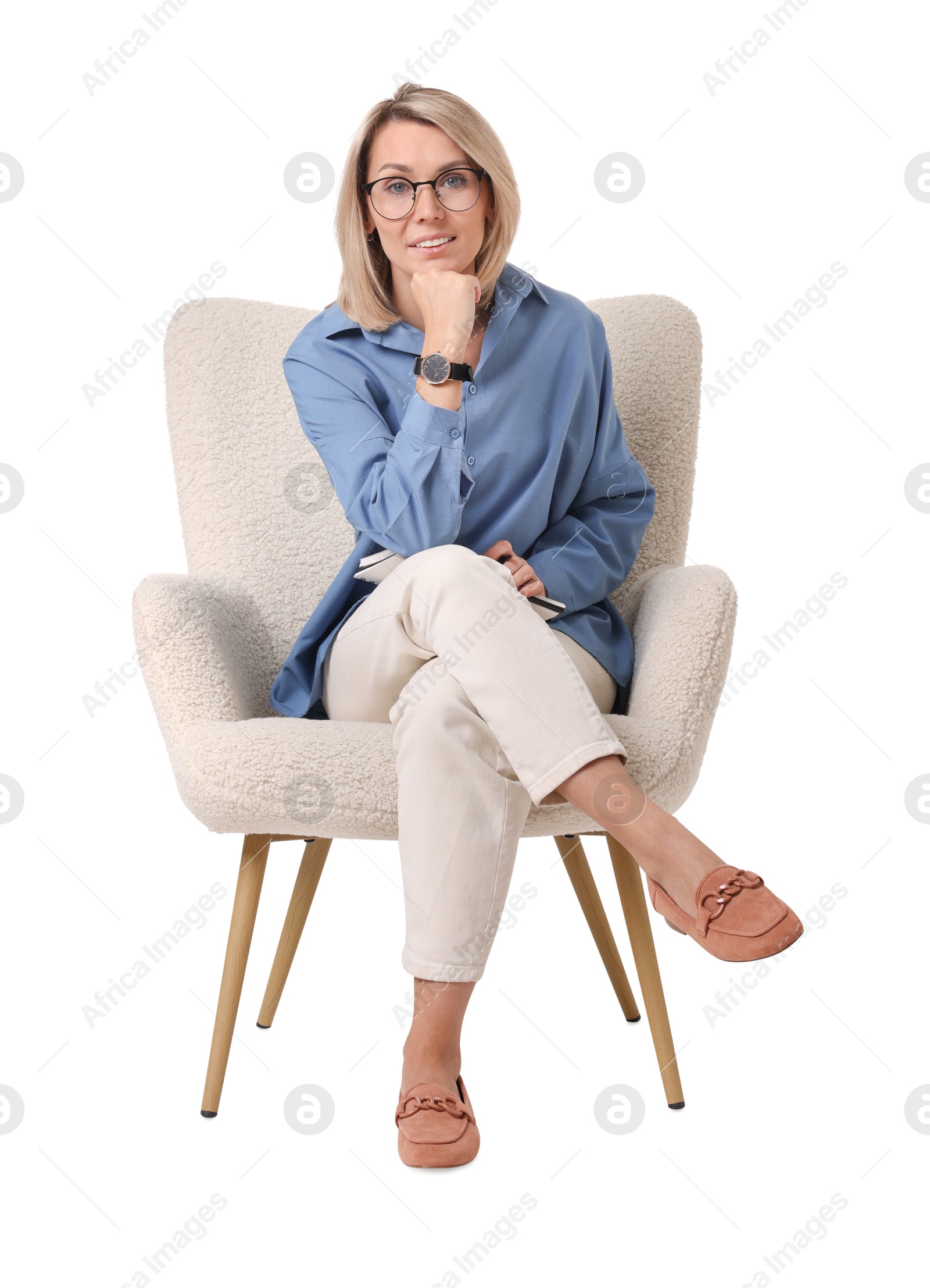 Photo of Professional psychologist with notebook sitting on chair against white background