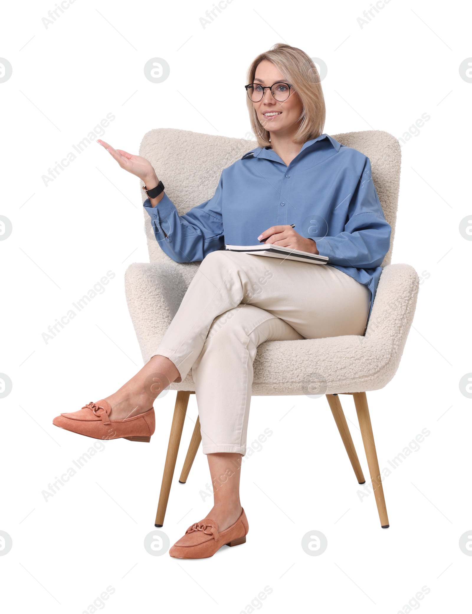 Photo of Professional psychologist with notebook sitting on chair against white background