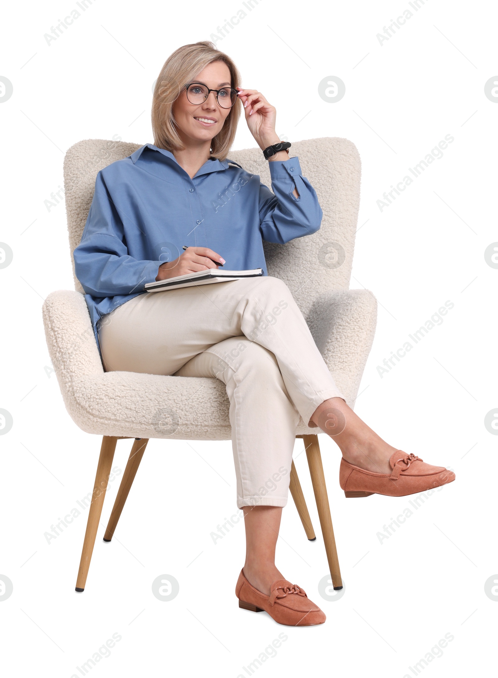 Photo of Professional psychologist with notebook sitting on chair against white background