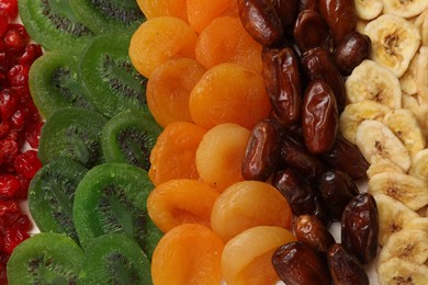 Photo of Mix of different dried fruits on table, top view