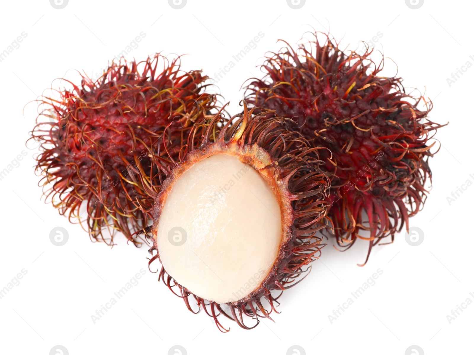 Photo of Delicious ripe rambutans isolated on white. Exotic fruit