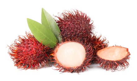 Photo of Delicious ripe rambutans and green leaves isolated on white. Exotic fruit