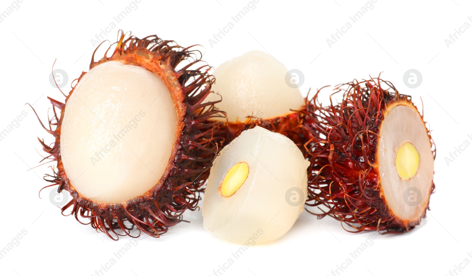 Photo of Delicious ripe rambutans isolated on white. Exotic fruit