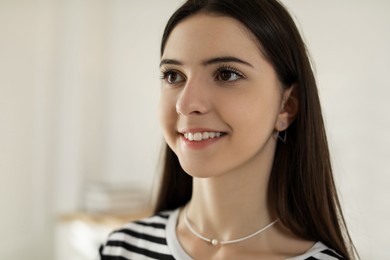 Photo of Portrait of smiling teenage girl at home