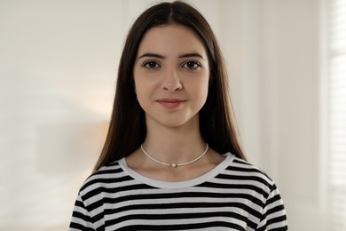 Photo of Portrait of beautiful teenage girl at home