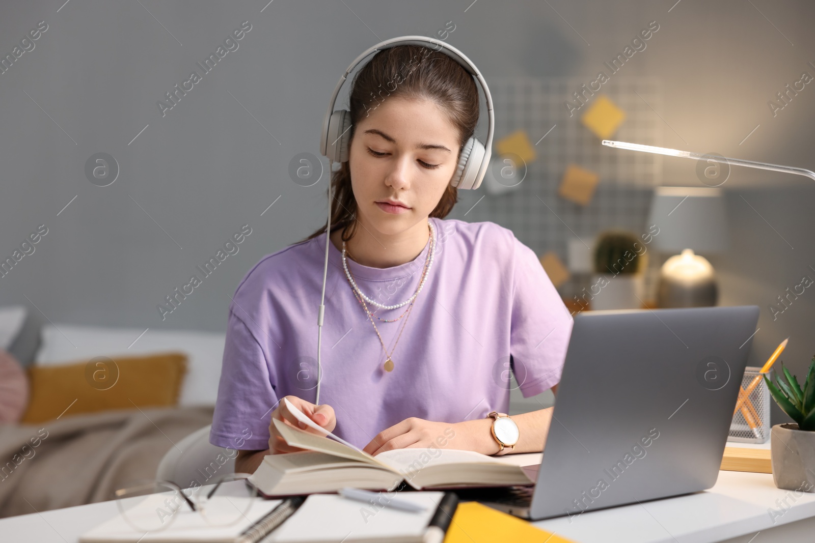 Photo of Student preparing for exam at table indoors